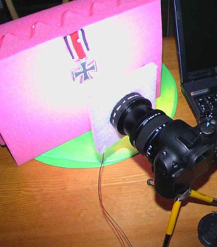 Photographing badges and medals.